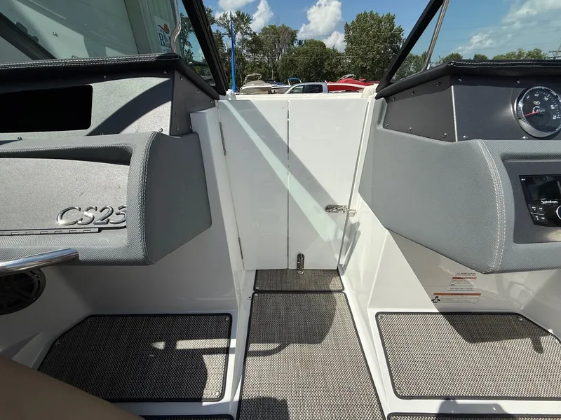 Slide: The Image of 2019 Cobalt CS23 boat interior with dashboard and seating, showcasing modern design and features. - 20