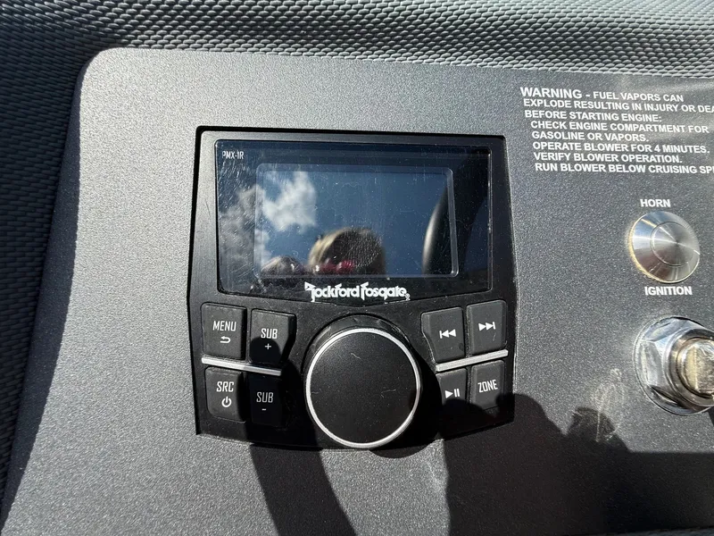 Slide: The Image of Rockford Fosgate audio system on 2019 Cobalt CS23 dashboard with control buttons and warning label. - 22