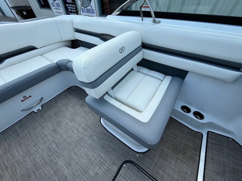 Slide: The Image of Interior of a 2019 Cobalt CS23 boat featuring white and gray seating. - 28
