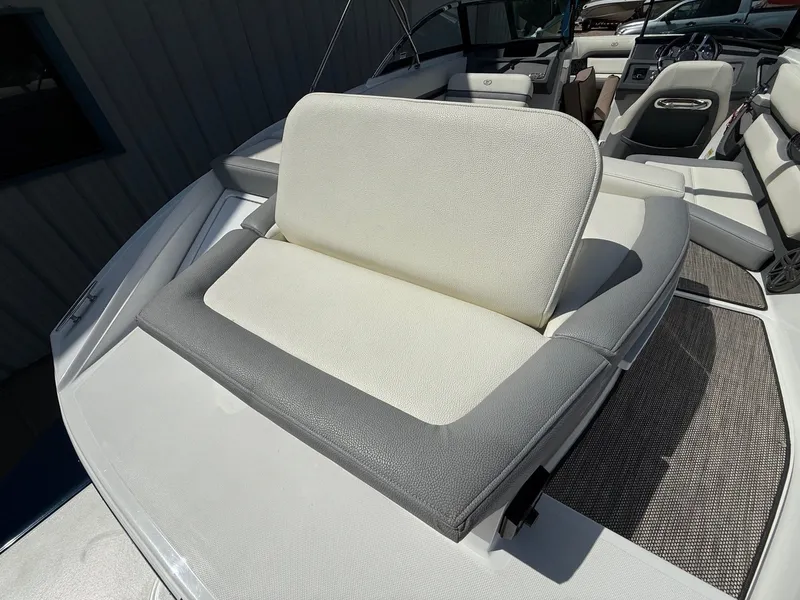 Slide: The Image of 2019 Cobalt CS23 boat interior with white and gray seating, showcasing luxury design. - 38