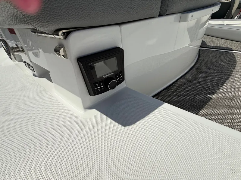 Slide: The Image of 2019 Cobalt CS23 boat interior with audio control panel and seating. - 39
