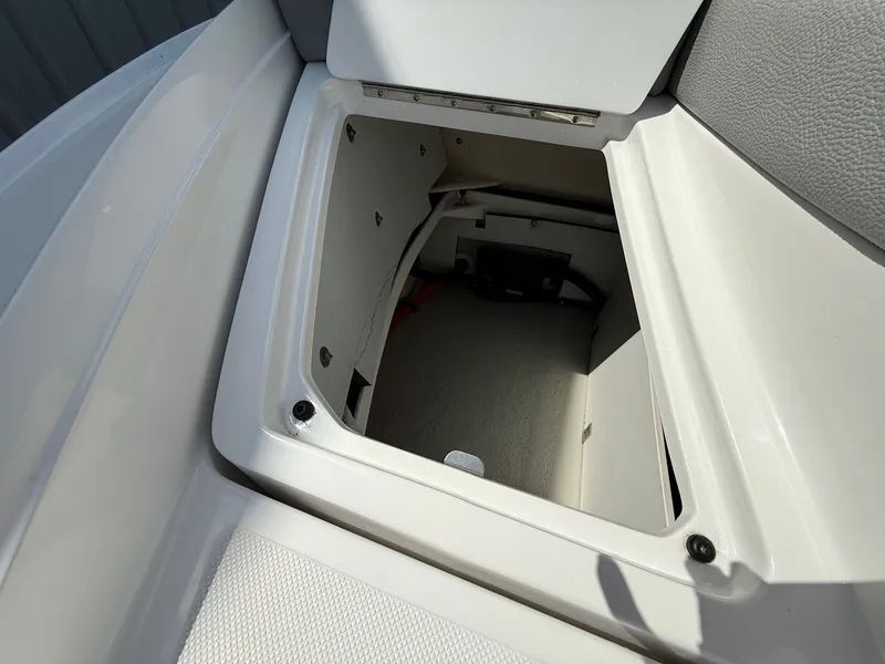 Slide: The Image of Open storage compartment in 2019 Cobalt CS23 boat interior. - 40