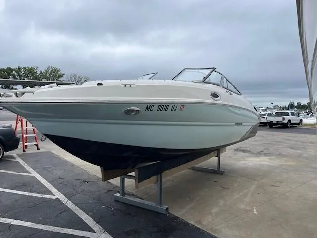 Slide: The Image of 2018 Stingray 235 LR boat on display in a parking lot. - 3