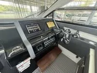 Slide: The Image of 2022 Cruisers 42 GLS helm with modern controls and navigation display. - 21