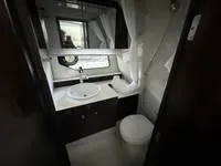Slide: The Image of 2022 Cruisers 42 GLS yacht bathroom with modern fixtures and sleek design. - 27