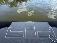 Slide: The Image of 2022 Cruisers 42 GLS swim platform on calm water. - 39