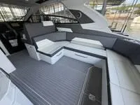 Slide: The Image of Helm of 2022 Cruisers 42 GLS yacht with modern navigation displays and controls. - 19