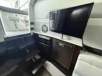 Slide: The Image of 2022 Cruisers 42 GLS yacht interior with modern seating and sleek design. - 30