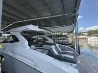 Slide: The Image of 2022 Cruisers 42 GLS helm with dual screens and modern controls. - 38