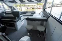 Slide: The Image of 2022 Cruisers 42 GLS yacht interior with branded seating and modern design. - 50