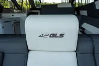 Slide: The Image of 2022 Cruisers 42 GLS yacht side view with logo detail. - 53