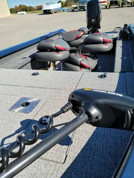 Slide: The Image of 2021 Ranger VS1660T boat deck with Minn Kota trolling motor and cushioned seats. - 5