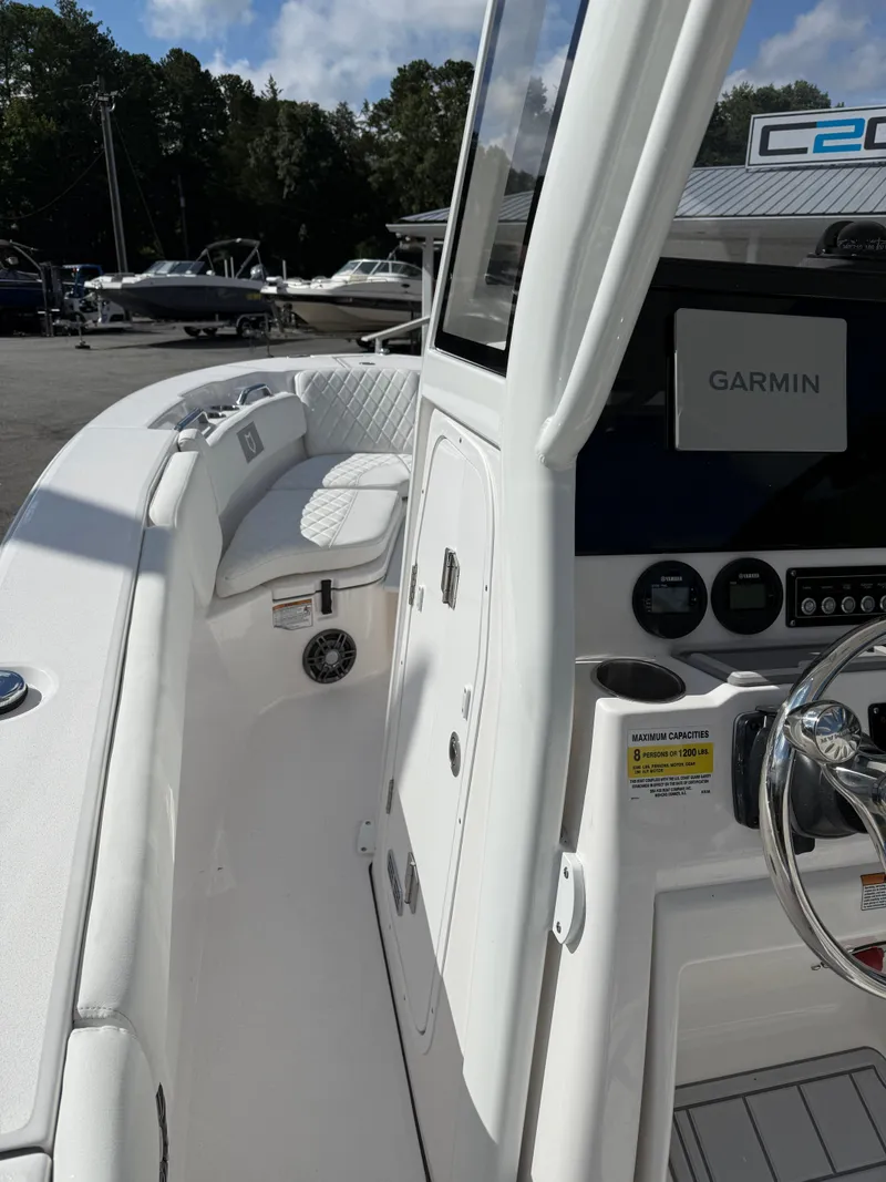 Slide: The Image of 2026 Sea Fox 228 Commander boat interior with Garmin navigation system and seating. - 6
