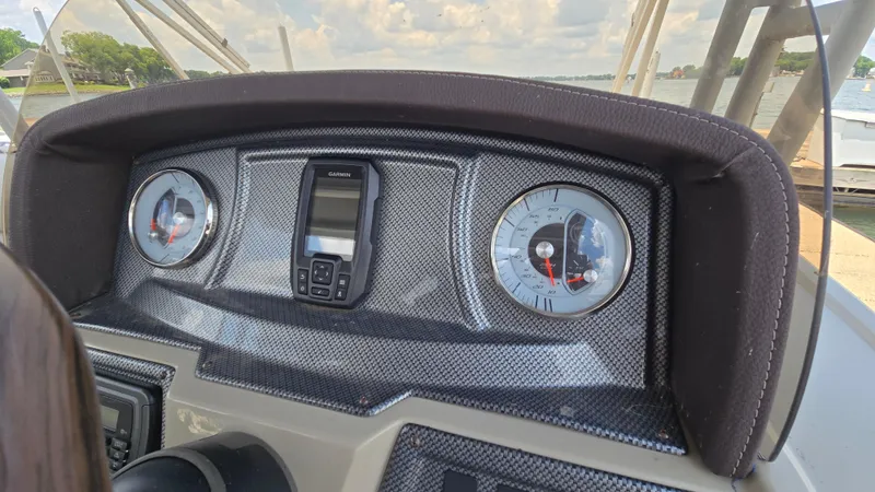 Slide: The Image of Dashboard of 2017 Premier 240 SunSation boat with gauges and Garmin device. - 21