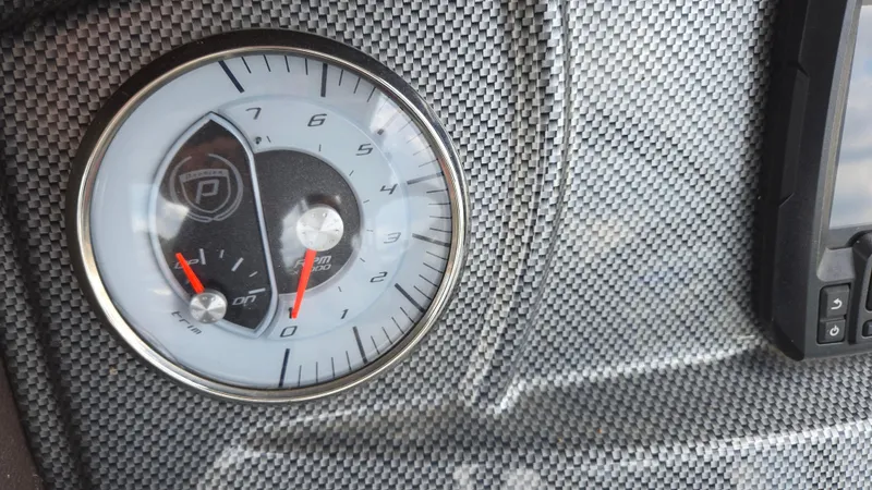 Slide: The Image of Dashboard gauge of 2017 Premier 240 SunSation boat with carbon fiber texture. - 22