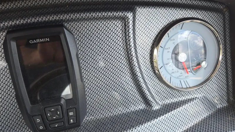 Slide: The Image of Dashboard of 2017 Premier 240 SunSation with Garmin device and speedometer. - 23