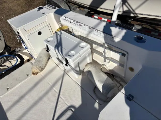 Slide: The Image of 1997 Wellcraft 210 Coastal boat deck with cooler and storage compartments. - 10