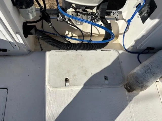 Slide: The Image of 1997 Wellcraft 210 Coastal boat interior showing engine compartment and wiring. - 15