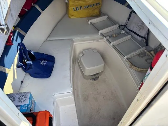 Slide: The Image of Interior cabin of a 1997 Wellcraft 210 Coastal boat with seating and storage. - 30