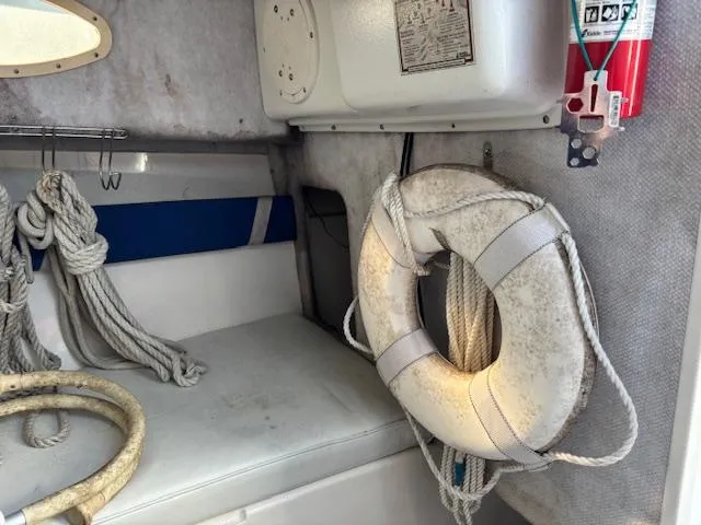 Slide: The Image of Interior of a 1997 Wellcraft 210 Coastal boat with life preserver and ropes. - 32