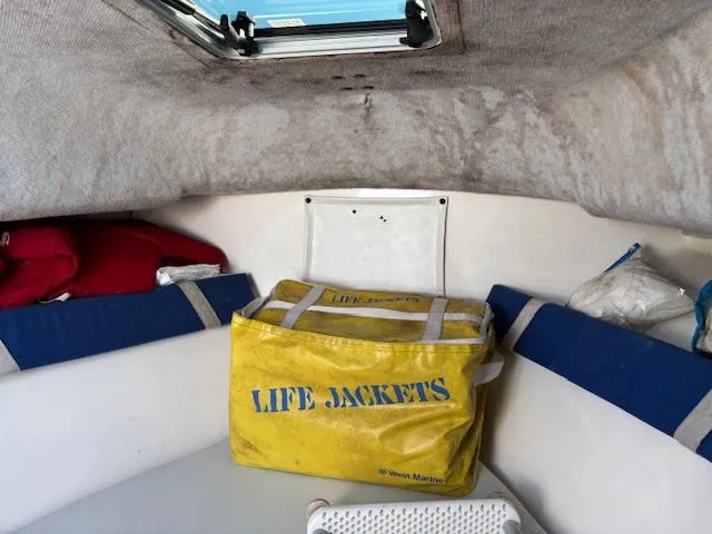 Slide: The Image of Interior of a 1997 Wellcraft 210 Coastal boat with life jackets stored. - 35