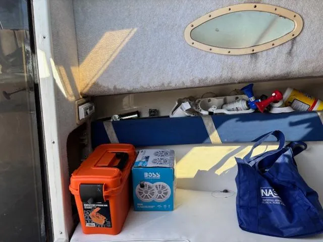 Slide: The Image of Interior of a 1997 Wellcraft 210 Coastal boat with tools and accessories. - 37