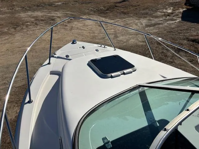 Slide: The Image of 1997 Wellcraft 210 Coastal boat deck with hatch and railing. - 40