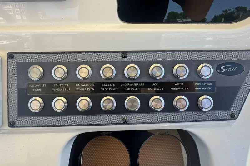 Slide: The Image of Control panel of 2023 Scout 255 LXF boat with labeled buttons for various functions. - 45