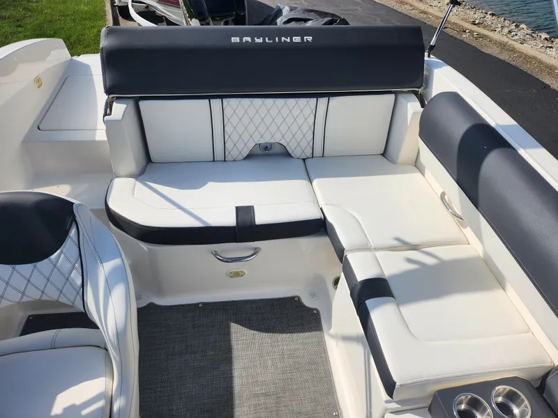 Slide: The Image of Bayliner DX 2000 2021 boat interior with white and black seating. - 23