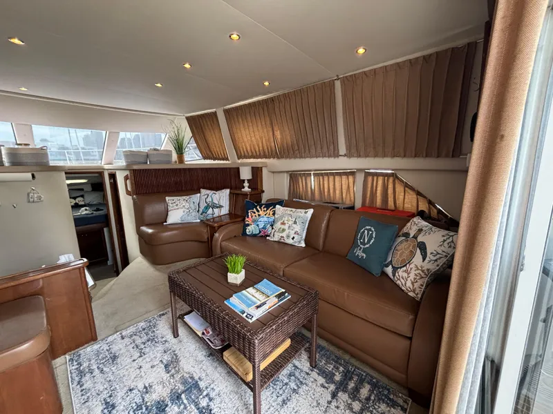 Slide: The Image of Luxurious interior of 2007 Carver 35 Super Sport yacht with leather seating and decorative pillows. - 12