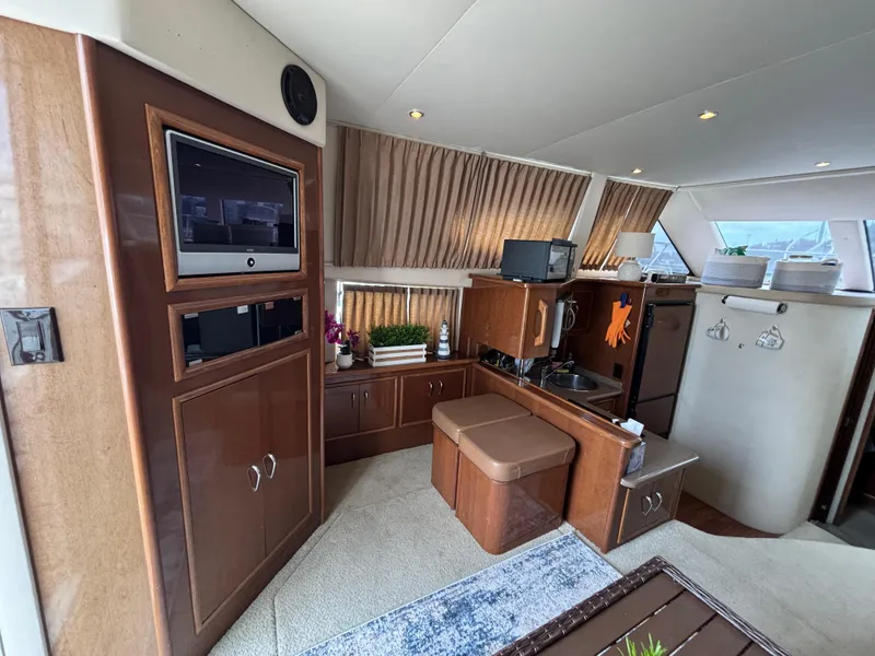 Slide: The Image of Interior of 2007 Carver 35 Super Sport yacht with modern amenities and wood finishes. - 13