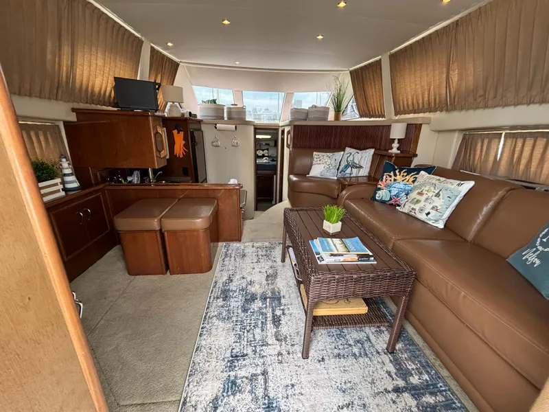 Slide: The Image of Interior of 2007 Carver 35 Super Sport yacht with cozy seating and elegant decor. - 14