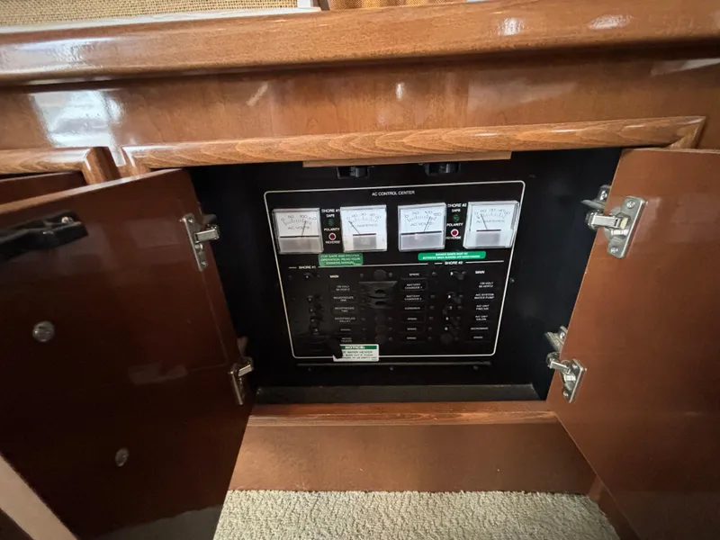 Slide: The Image of Electrical control panel inside a 2007 Carver 35 Super Sport boat cabinet. - 20