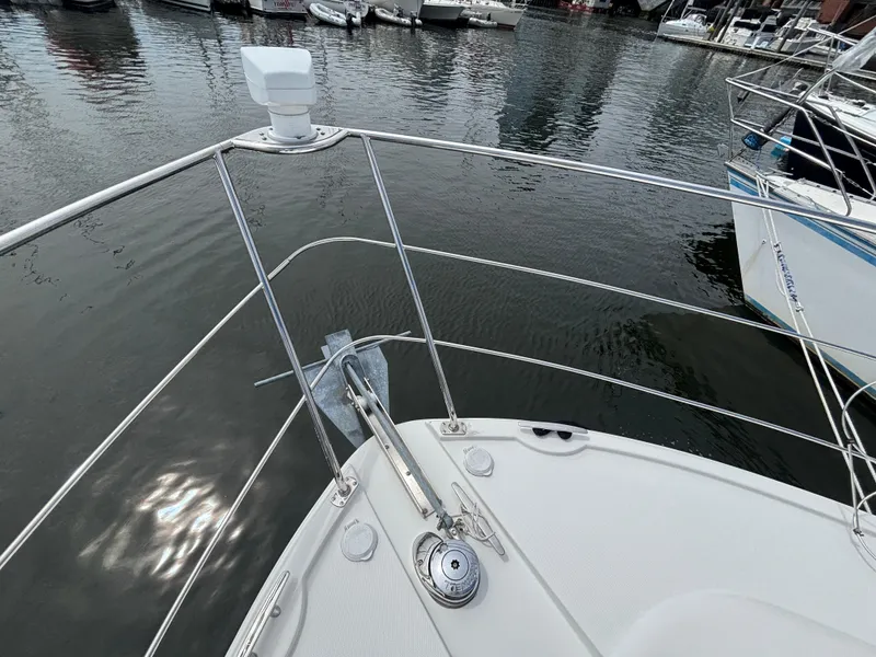 Slide: The Image of 2007 Carver 35 Super Sport yacht bow with anchor, docked in marina. - 27