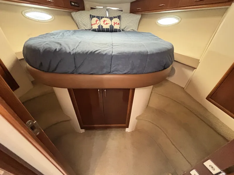 Slide: The Image of 2007 Carver 35 Super Sport cabin with cozy bed and elegant wood cabinetry. - 28