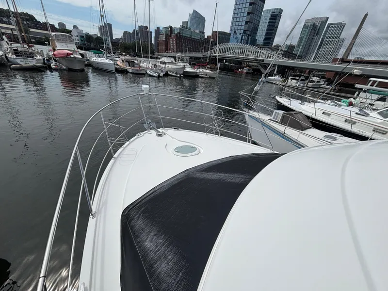 Slide: The Image of 2007 Carver 35 Super Sport yacht docked in urban marina with city skyline. - 29
