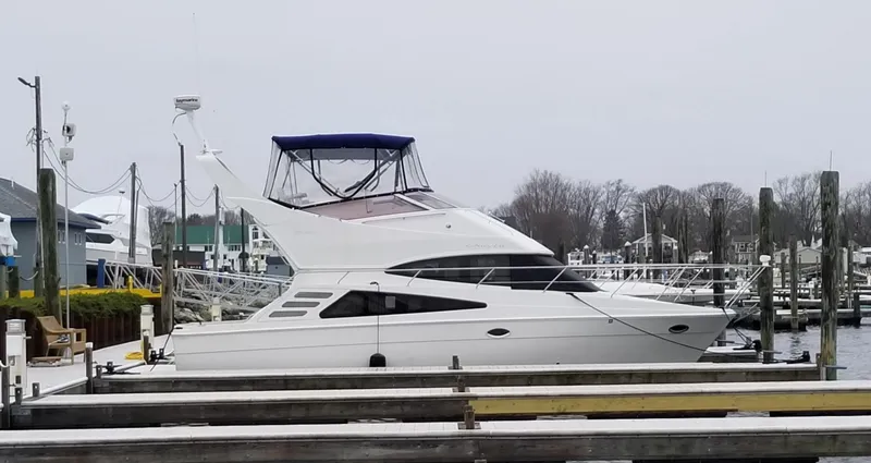 Slide: The Image of 2007 Carver 35 Super Sport yacht docked at a marina on a cloudy day. - 30