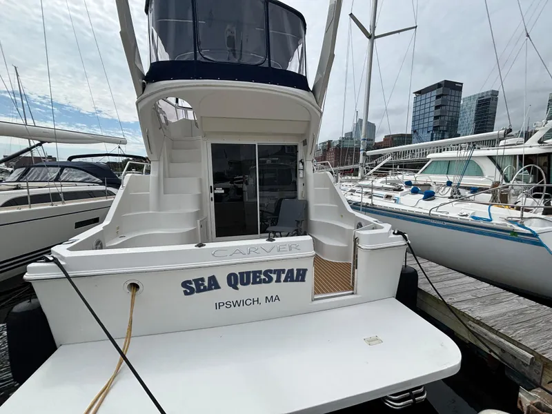 Slide: The Image of 2007 Carver 35 Super Sport yacht docked, named "Sea Questah," in Ipswich, MA marina. - 4