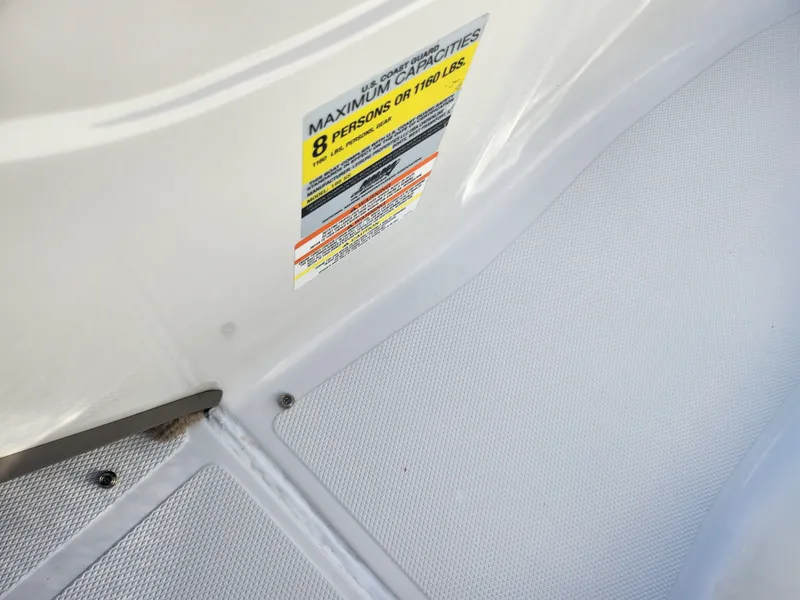 Slide: The Image of 2012 Crownline 195 SS boat interior with capacity label for 8 persons or 1180 lbs. - 14