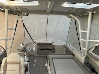 Slide: The Image of 2023 Solara S-250 DC boat interior with seating and canopy, showcasing modern design. - 13