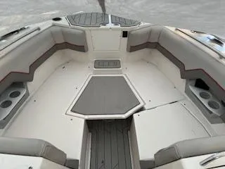 Slide: The Image of 2023 Solara S-250 DC boat interior with cushioned seating and cup holders. - 15