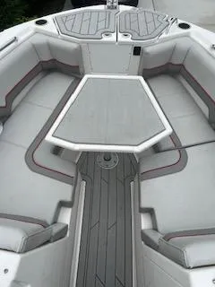 Slide: The Image of 2023 Solara S-250 DC boat interior with cushioned seating and table. - 16
