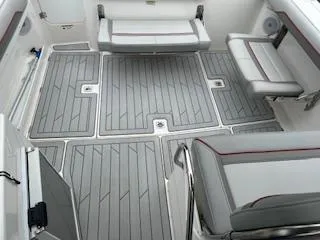 Slide: The Image of 2023 Solara S-250 DC boat interior with gray seating and flooring. - 20