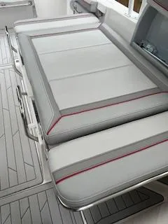 Slide: The Image of 2023 Solara S-250 DC boat interior with sleek, cushioned seating and modern design. - 23
