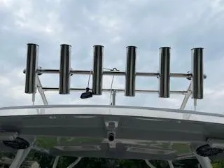 Slide: The Image of Stainless steel rod holders on a 2023 Solara S-250 DC boat against a cloudy sky. - 30