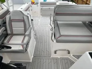 Slide: The Image of 2023 Solara S-250 DC boat interior with gray seating and modern design. - 31