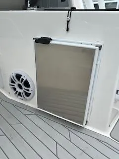 Slide: The Image of 2023 Solara S-250 DC boat interior with speaker and storage compartment. - 35