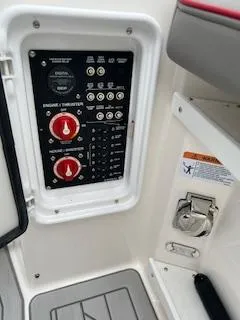 Slide: The Image of Control panel of 2023 Solara S-250 DC boat with switches and indicators. - 36