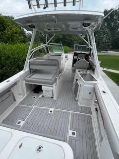 Slide: The Image of 2023 Solara S-250 DC boat interior with seating, helm, and modern amenities. - 37