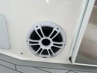 Slide: The Image of 2023 Solara S-250 DC boat speaker, white casing, mounted on interior panel. - 41